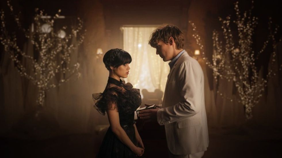 Wednesday Addams, played by Jenna Ortega, and Tyler Galpin, played by Hunter Doohan, going to a formal dance in 'Wednesday'
