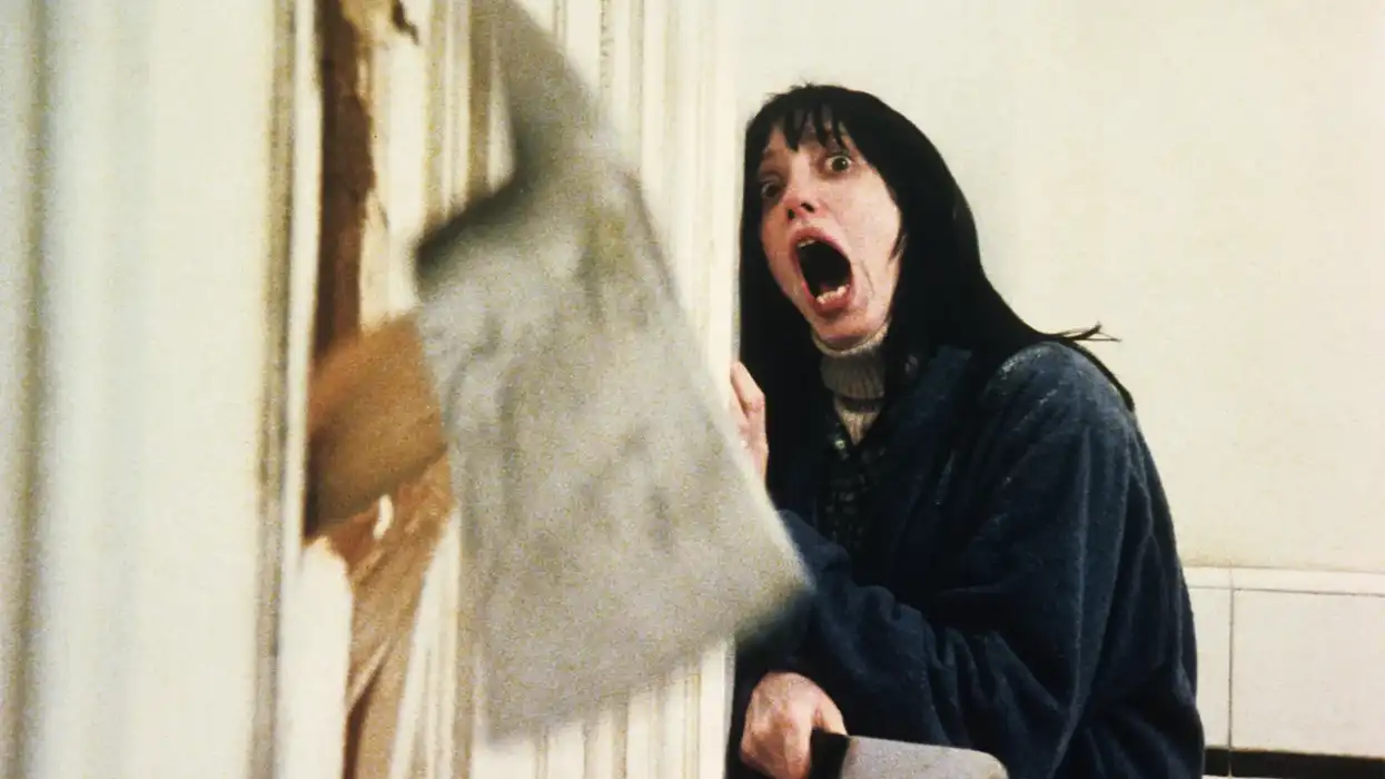 Wendy Torrance, played by Shelley Duvall, screaming in a bathroom as an ax breaks through the door in 'The Shining'