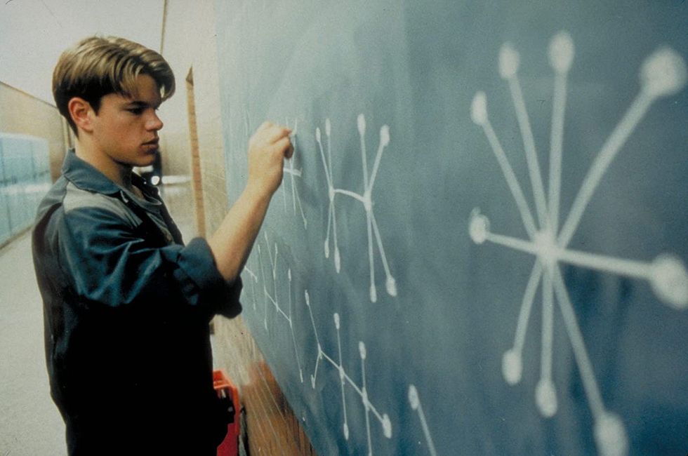 Will Hunting, played by Matt Damon, writing on a chalkboard in 'Good Will Hunting'