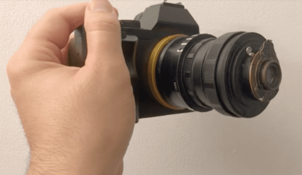 With a pair of adapters and a rubber band from an old tire, a 100 year old lens sees light again on a DSLR.
