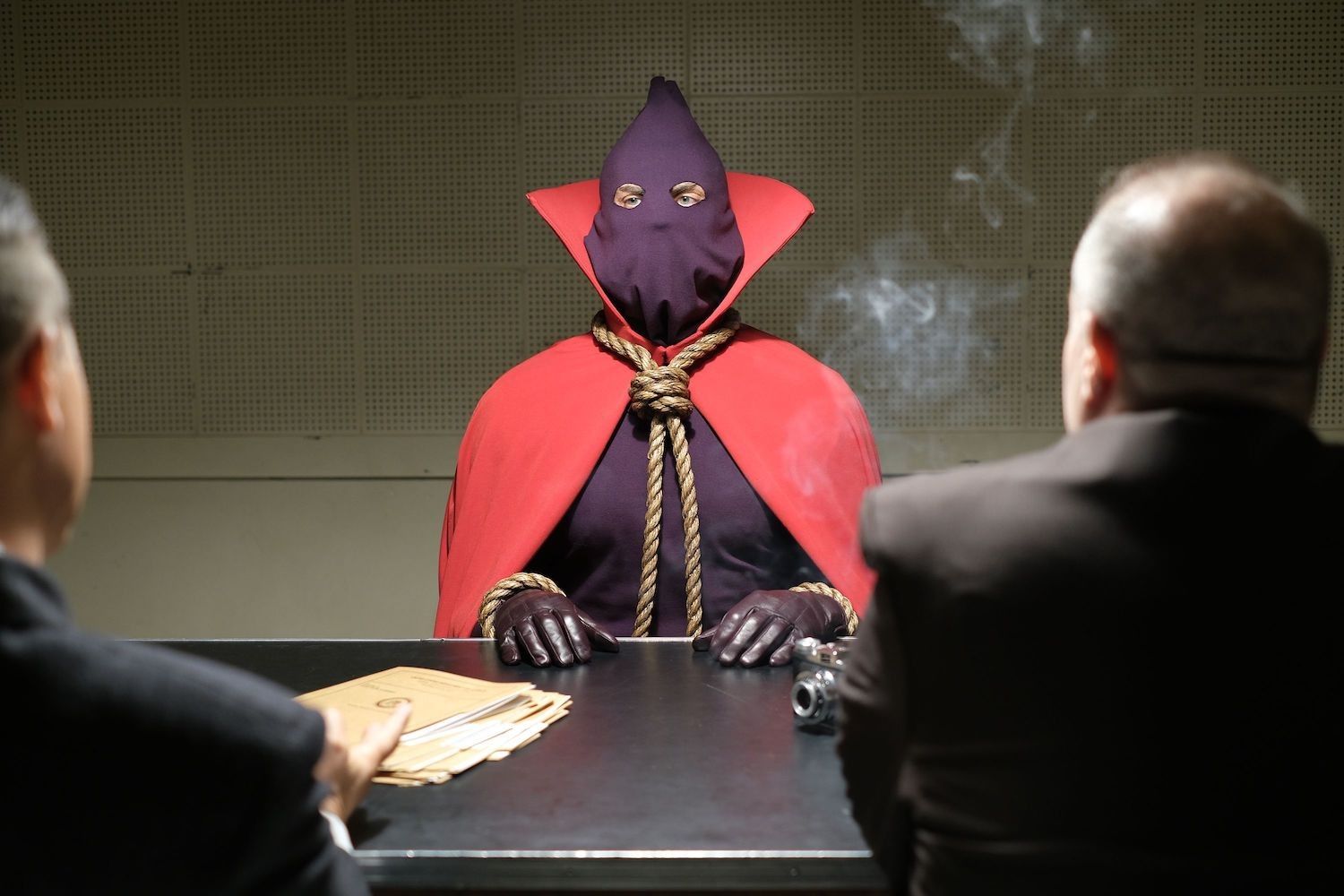 Hooded Justice sits in interrogation room on HBO's Watchmen. 